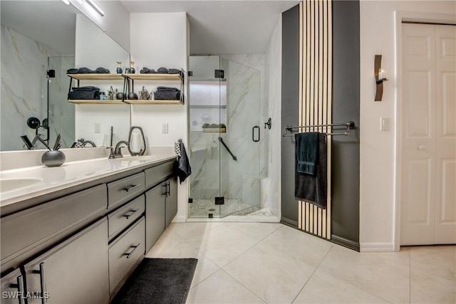 bathroom featuring vanity, tile patterned floors, and walk in shower