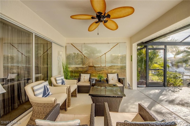 sunroom featuring ceiling fan