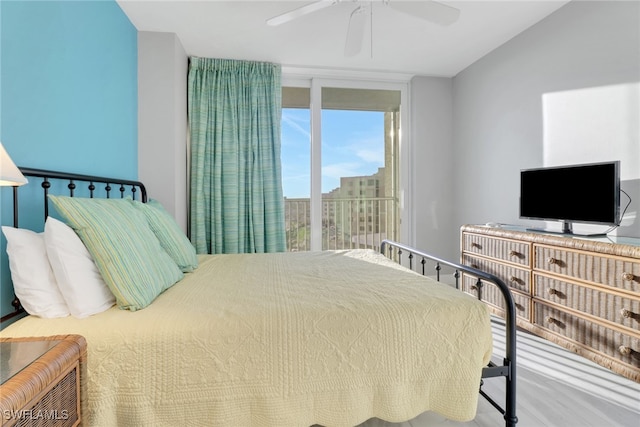 bedroom featuring floor to ceiling windows and ceiling fan