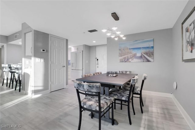 dining area with a chandelier