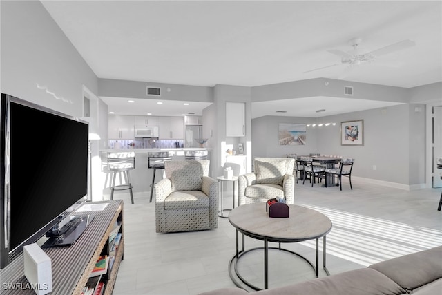 living room featuring ceiling fan