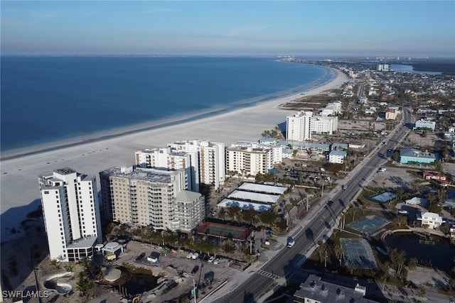 bird's eye view with a water view and a beach view