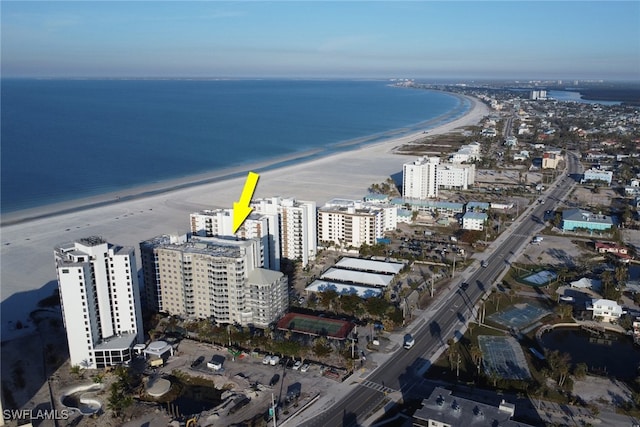 aerial view with a water view and a beach view