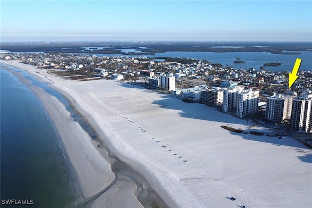 bird's eye view featuring a view of the beach and a water view