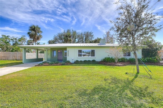 ranch-style house with a front yard and a carport