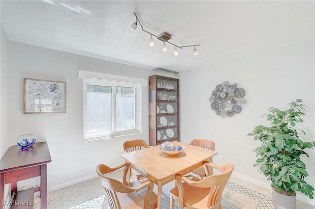 dining room with track lighting