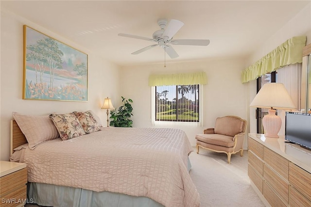 bedroom with light colored carpet and ceiling fan