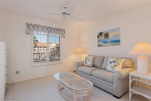 carpeted living room with ceiling fan