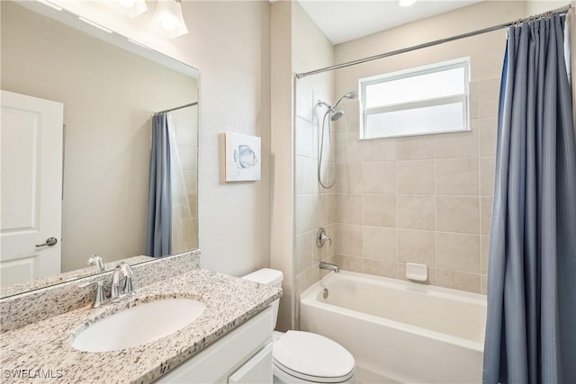 full bathroom featuring vanity, toilet, and shower / bath combo with shower curtain