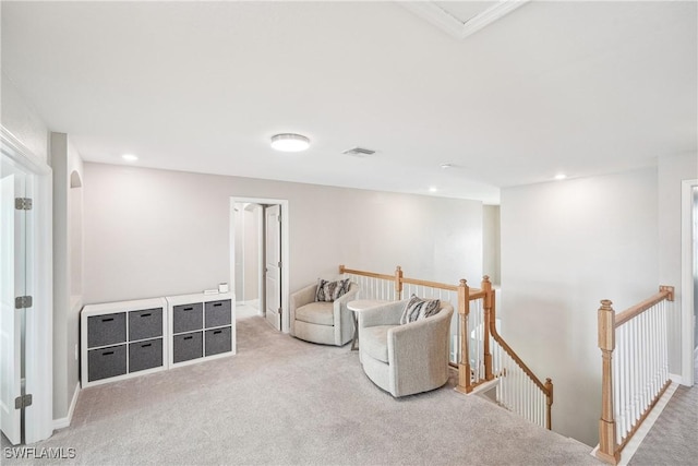 living area featuring light colored carpet