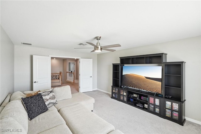 carpeted living room featuring ceiling fan