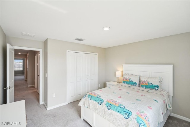 bedroom with carpet and a closet