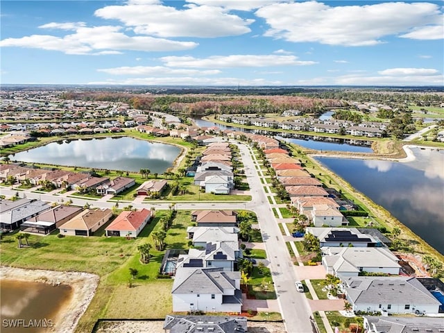 drone / aerial view with a water view