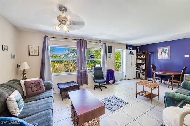 living room featuring light tile patterned floors and ceiling fan