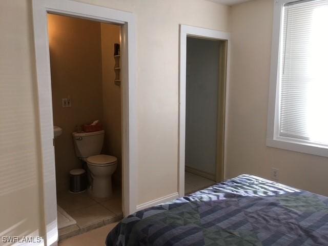 bedroom with tile patterned floors