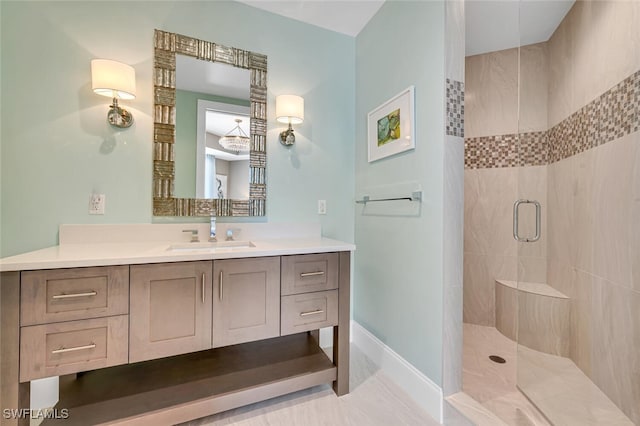 bathroom featuring vanity and a shower with shower door