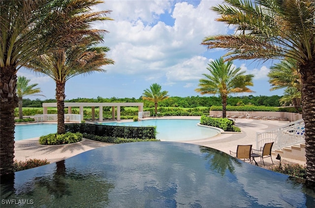 view of swimming pool featuring a patio area