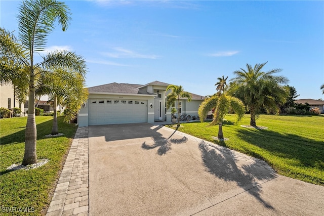 view of front facade with a garage and a front lawn