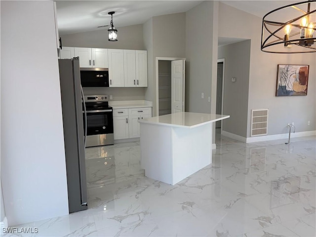 kitchen with appliances with stainless steel finishes, a center island, hanging light fixtures, and white cabinets