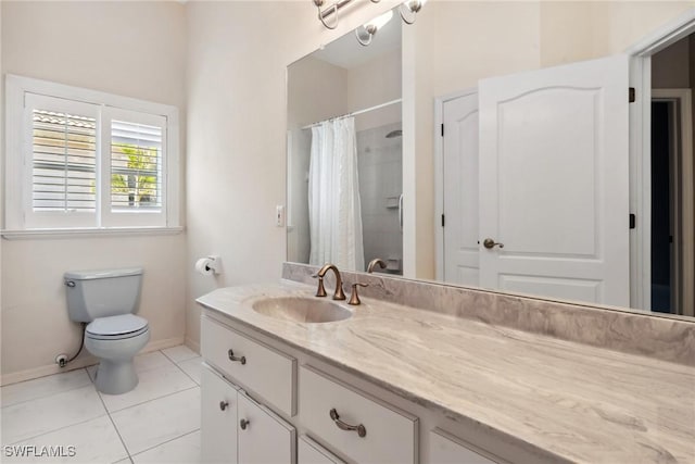 bathroom featuring toilet, vanity, a shower with curtain, baseboards, and tile patterned floors