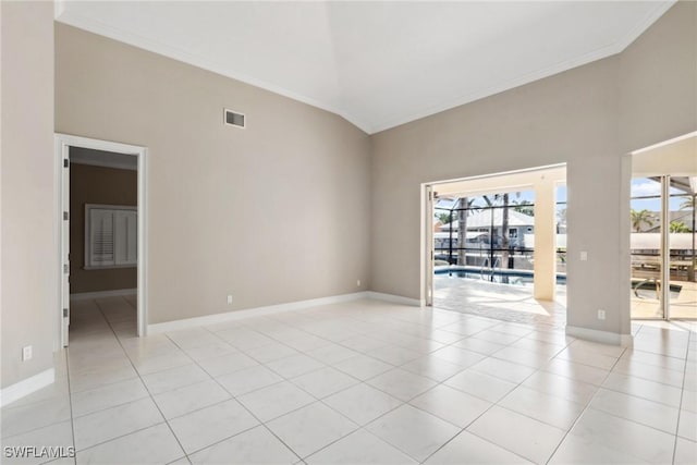 spare room with ornamental molding, visible vents, plenty of natural light, and light tile patterned flooring