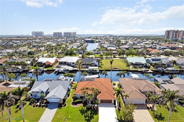 bird's eye view with a water view and a residential view