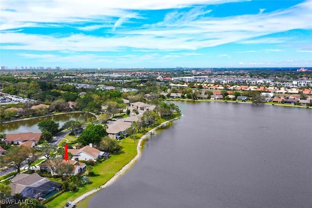 bird's eye view featuring a water view and a residential view