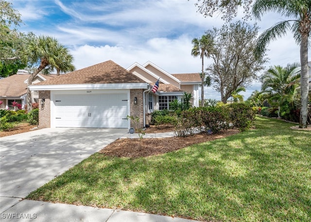 single story home with a garage, concrete driveway, brick siding, and a front lawn