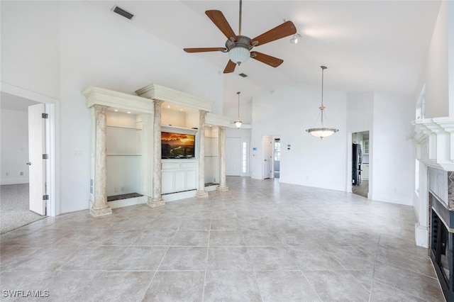 unfurnished living room with a fireplace, visible vents, ceiling fan, high vaulted ceiling, and tile patterned flooring