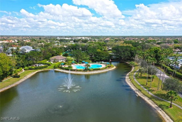 birds eye view of property with a water view