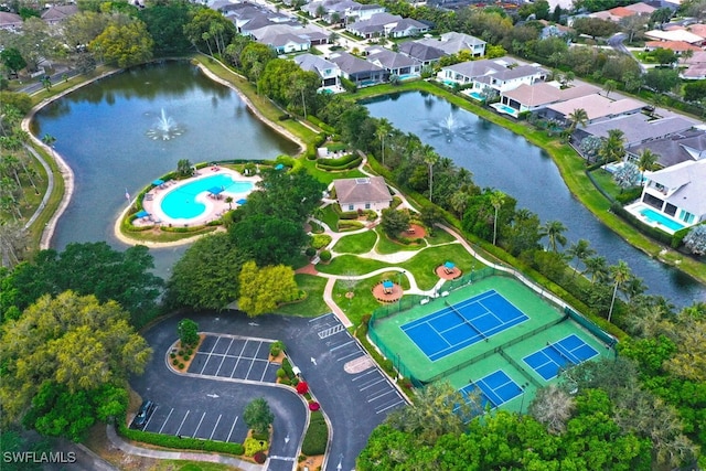 drone / aerial view featuring a water view and a residential view