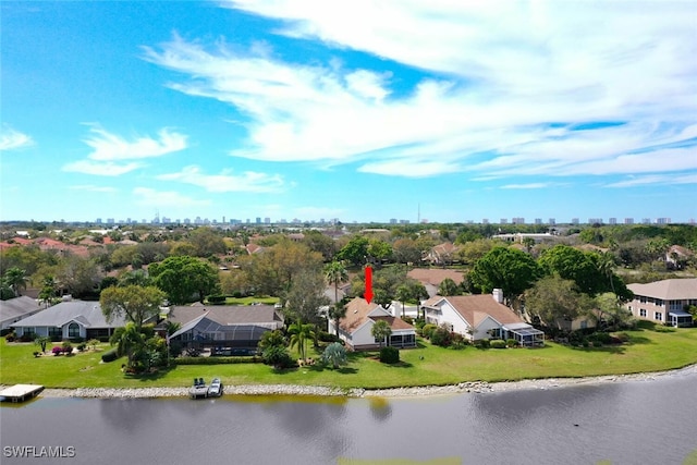 birds eye view of property featuring a residential view and a water view