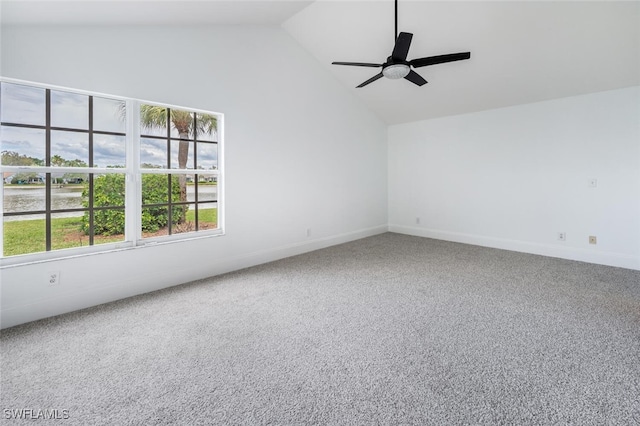 carpeted empty room featuring ceiling fan, baseboards, and vaulted ceiling