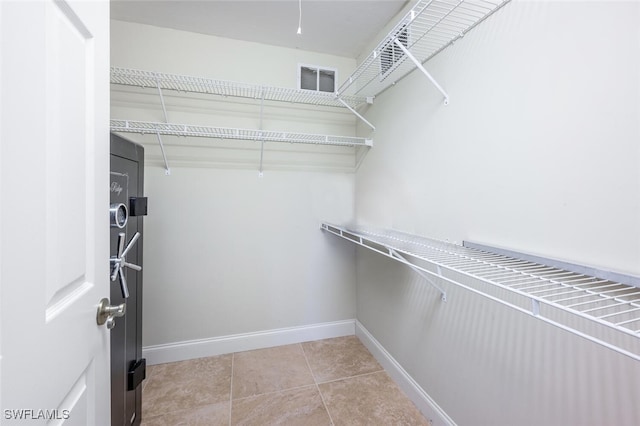 walk in closet featuring visible vents and light tile patterned flooring