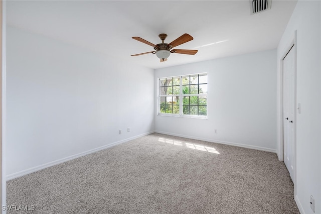 unfurnished bedroom featuring a closet, visible vents, carpet flooring, ceiling fan, and baseboards