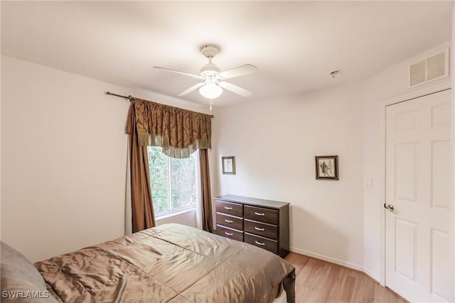 bedroom featuring ceiling fan and light wood-type flooring