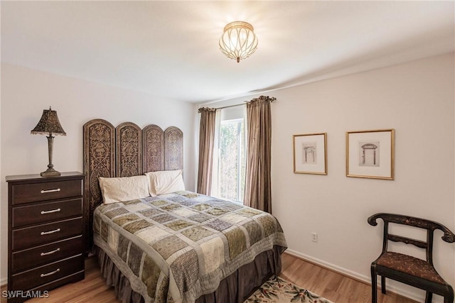 bedroom with light hardwood / wood-style flooring