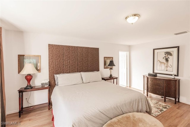 bedroom with light hardwood / wood-style flooring