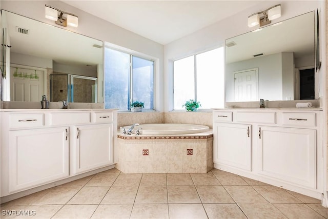 bathroom featuring vanity, independent shower and bath, and tile patterned flooring