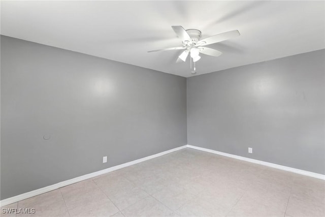 spare room with ceiling fan