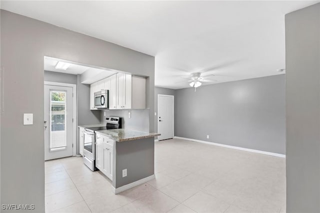 kitchen featuring white cabinetry, light tile patterned floors, ceiling fan, light stone counters, and stainless steel appliances