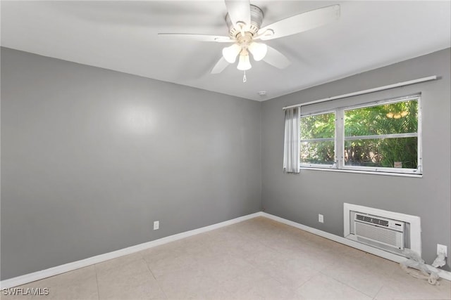 tiled empty room with a wall mounted air conditioner and ceiling fan