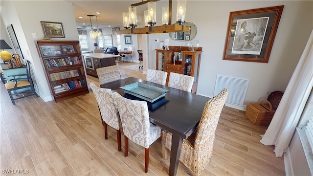 dining space featuring light hardwood / wood-style flooring