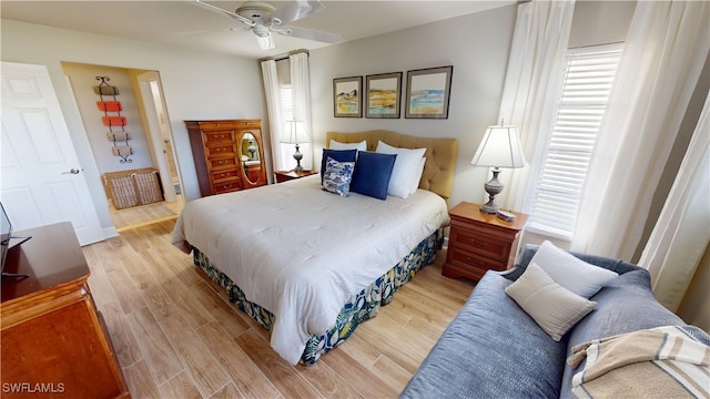 bedroom featuring ceiling fan and light wood-type flooring