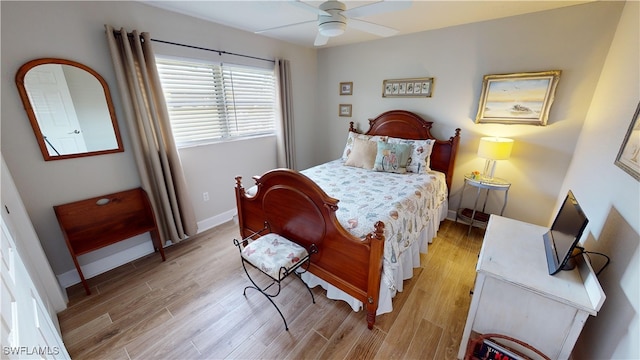 bedroom with light hardwood / wood-style flooring and ceiling fan