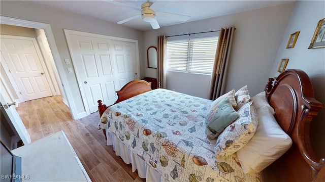 bedroom with light hardwood / wood-style floors, a closet, and ceiling fan