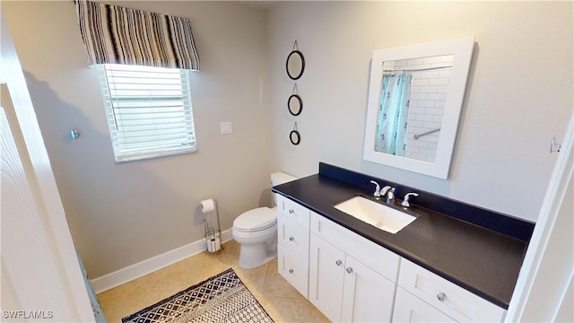 bathroom with a shower with curtain, vanity, tile patterned floors, and toilet