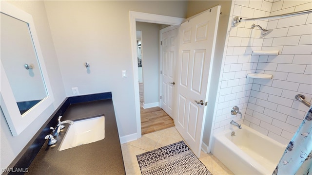 bathroom featuring vanity, tile patterned flooring, and shower / bath combo with shower curtain