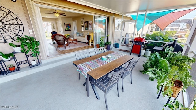 sunroom featuring ceiling fan