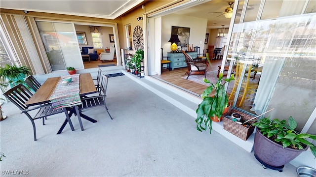 view of patio featuring ceiling fan